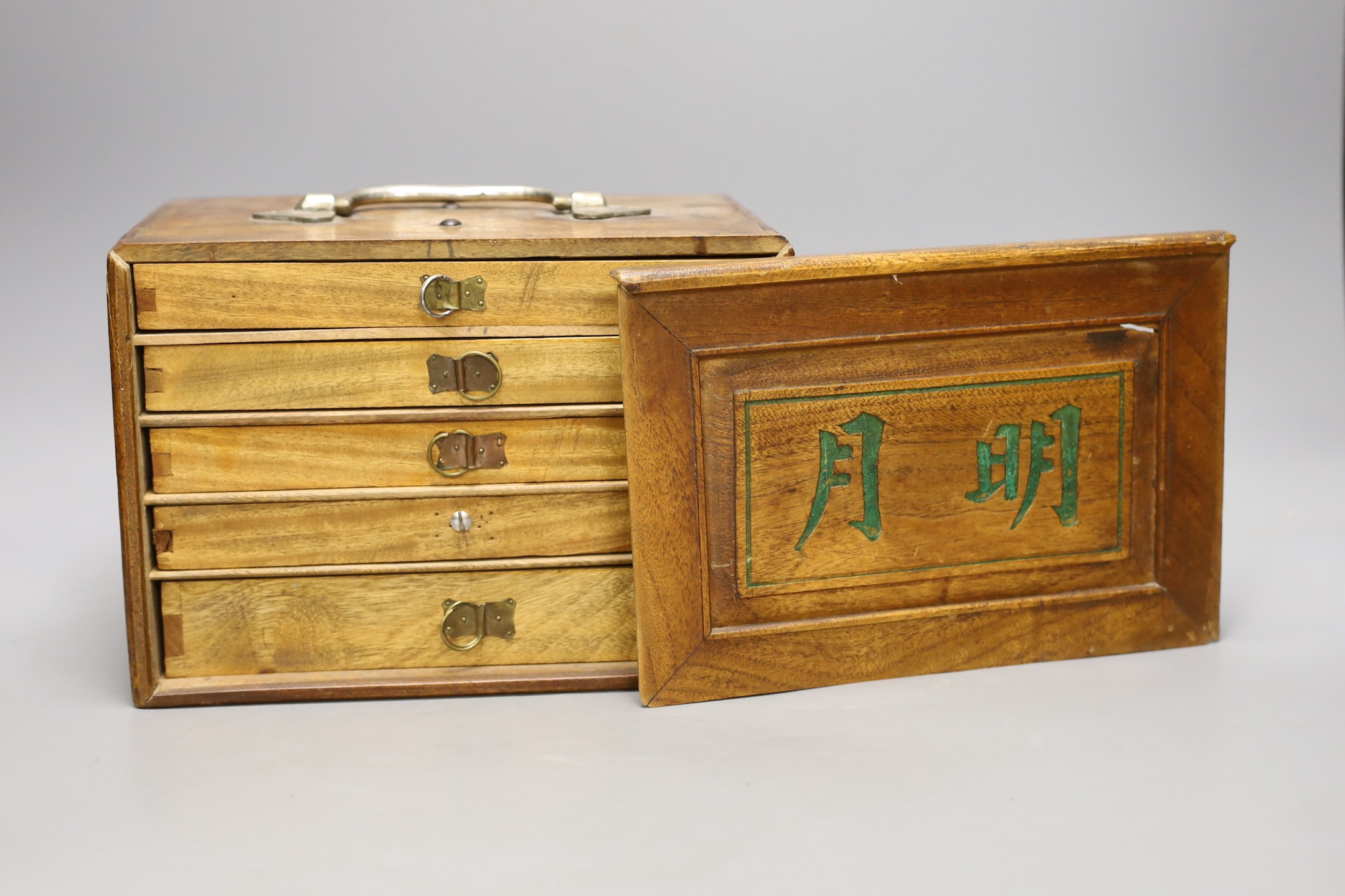 A Chinese bamboo and and bone mahjong set, 18 cms high x 25ms wide.